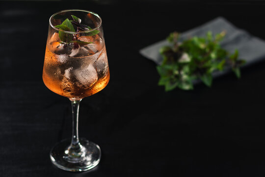 refreshing bar drink rosato mio made with ramazzotti, basil and ice
