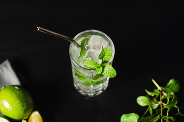 tropical night drink mojito with foliage background