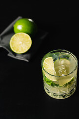 Brazilian caipirinha drink with cachaça, lemon, sugar and ice