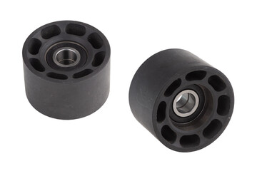 Two tensioning rollers of the engine timing belt on a gray background. New spare parts for car engine repair