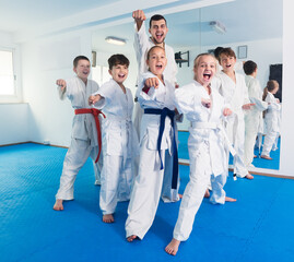 Different ages boys and girls expressing interest in attending karate class