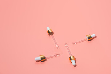 Dropper glass bottles with pipette. Transparent hyaluronic natural beauty product and eco serum skin care concept. Top horizontal view copyspace.