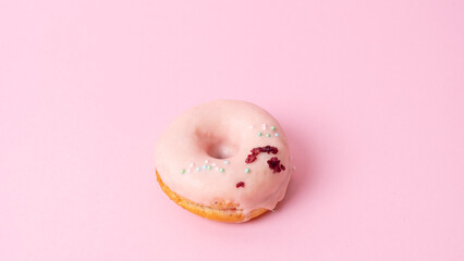 Tempting donuts dessert with iceing and sprinkles. Sweet sugar round doughnuts of different...