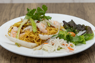 Hearty plate of garlic shrimp and Vietnamese noodles for a complete meal