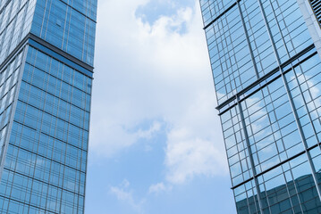 Fototapeta na wymiar Chengdu cityscape low angle view of modern office building with clouds blue sky 