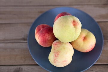 Washed peaches on the plate