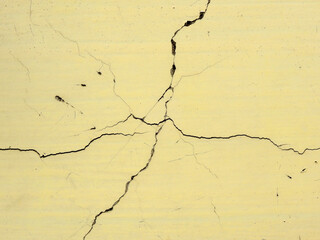 texture of yellow concrete wall with crack