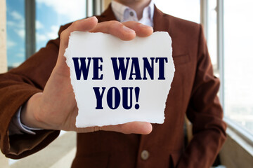 WE WANT YOU! message on the card shown by a man, vintage tone effect