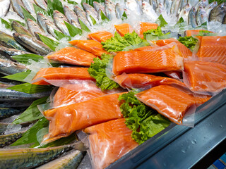 Fresh salmon fillet in plastic packing for sell in supermarket or seafood market.