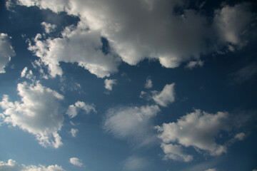 white fluffy clouds on blue sky. Weather concept