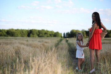 Summer landscape and a girl on nature walk in the countryside.