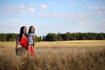 Summer landscape and a girl on nature walk in the countryside.