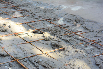 A close-up of a welded wire fabric in concrete floor slab. Reinforcing bar mesh installed...