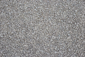 Crushed stone is a gray stone for construction, used for roads and concrete.