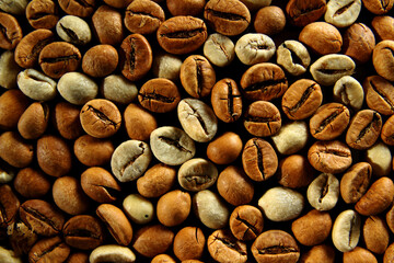Mixture of raw and roasted coffee beans texture