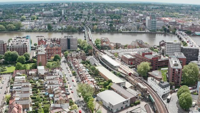 Stationary aerial drone shot of Putney bridge Tube station West London