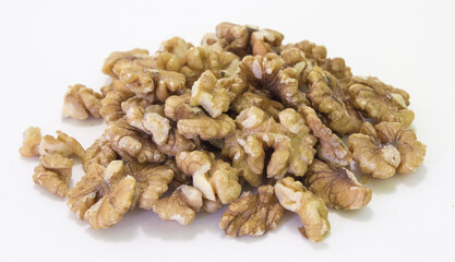 A heap of walnut kernel isolated on white background with shadows. Vegetarian source of fats and protein. 