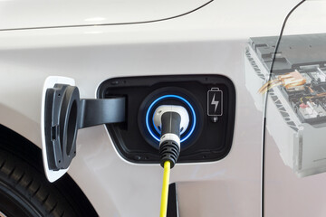 Close up Power supply connect to electric car for add charge to the battery. Charging re technology...
