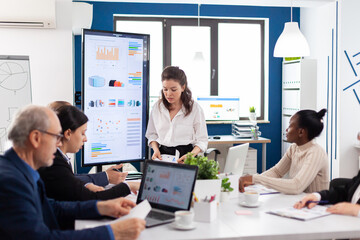 Mad startup business owner nervous screaming at diverse associates or colleagues in briefingroom. Businesswoman raging about multitasking difficult job, screaming in boardroom