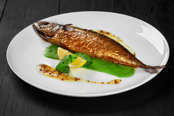 Grilled mackerel with green pea puree, herbal sauce and lemon
