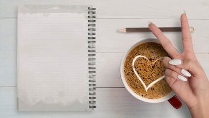 Top view of empty note   heart sign with coffee hand victory