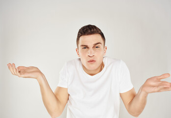 man in white t-shirt cropped view studio tinplate hands