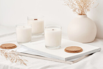 Handmade scented candles in a glass with a wooden lid. Soy wax candles with a wooden wick. Front...