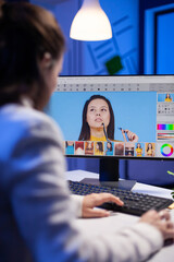 Creative creator doing portrait retouch using color grade late at night in professional editing office. Graphic editor retouching photos of a client on performance pc before deadline