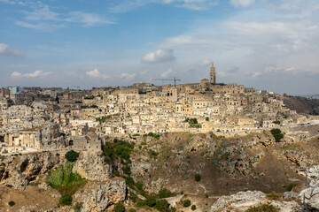 Panoramic view of Sassi di Matera a historic district in the city of Matera, well-known for their ancient cave dwellings from the Belvedere di Murgia Timone,  Basilicata, Italy
