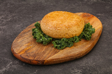 Smoked Georgian suluguni cheese piece