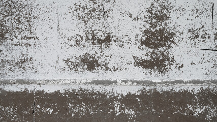 An old destroyed wall with cracks and scratches. Abstract grunge background texture for design posters, advertising and more.