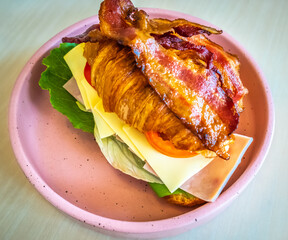 croissant sandwich with mozzarella and tomato