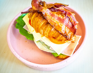croissant sandwich with mozzarella and tomato