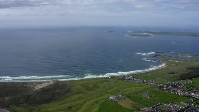Sligo Bay, Ireland, June 2021. Drone slowly pushes towards the coast with a breathtaking views of Atlantic ocean with Strandhill, Ballyconnel and the Donegal mountains on the horizon.