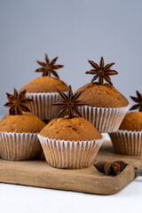 Biscuit muffins close-up. Sweet pastries. Party treat. Dessert on white table - homemade muffins. Portioned cupcakes. Simple muffin
