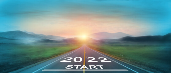 New year 2022 or start straight concept. word 2022 written on the road in the middle of asphalt...