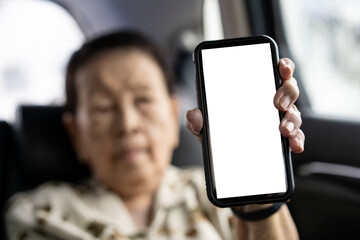 Asian old woman age 80 - 90 years old showing a blank screen smartphone.