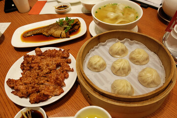 Chinese dim sum, Deep fried pork and fish served with wonton noodle soup and Xiao Long Bao (broth-filled Shanghainese steamed pork dumplings)