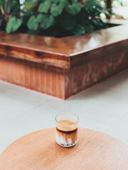 Espresso Shots Pour over cold fresh milk mixed with whipped cream. Until the dark brown of coffee gradually flows down and mixes with the white of fresh milk,  
