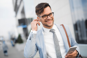 Successful stylish man with earphones
