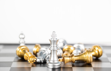 The silver king chess surrounded by chess pieces , business strategy
