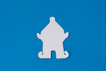 Step 2. Step-by-step instructions on how to make an elf out of colored paper and cardboard. DIY concept. Children's art project. Craft for children from colored paper for Christmas, St. Patrick's Day.