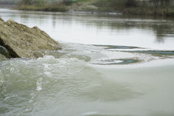 the water. cloudy water after floods. photo during the day.
