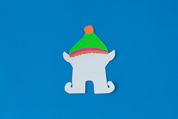 Step 6. Step-by-step instructions on how to make an elf out of colored paper and cardboard. DIY concept. Children's art project. Craft for children from colored paper for Christmas, St. Patrick's Day.