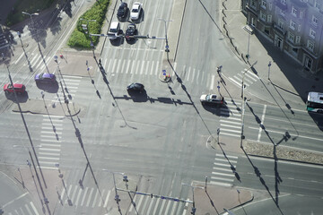 traffic light intersection photographed from above. shadows road traffic at dawn.