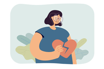 Cartoon girl holding broken heart. Depressed female character with torn heart in hand flat vector illustration. Breakup, relationship, mental health concept for banner, website design or landing page