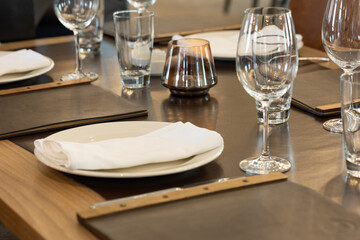 Brown wooden restaurant table ready to be served
