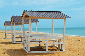 gazebo on a sunny beach, sea, sky