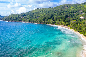 Fototapeta na wymiar Seychelles Takamaka beach Mahe island vacation sea ocean palms drone view aerial photo