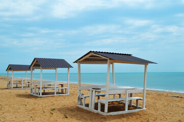gazebo on a sunny beach, sea, sky
